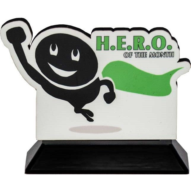 Custom-cut "H.E.R.O. of the Month" award with a black smiling figure, green cape, and ebony base.