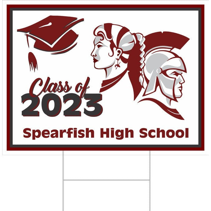 White 18"x24" yard sign with a maroon border, "Class of 2023 Spearfishing High School" text, graduation cap, and Spartan warrior graphics.