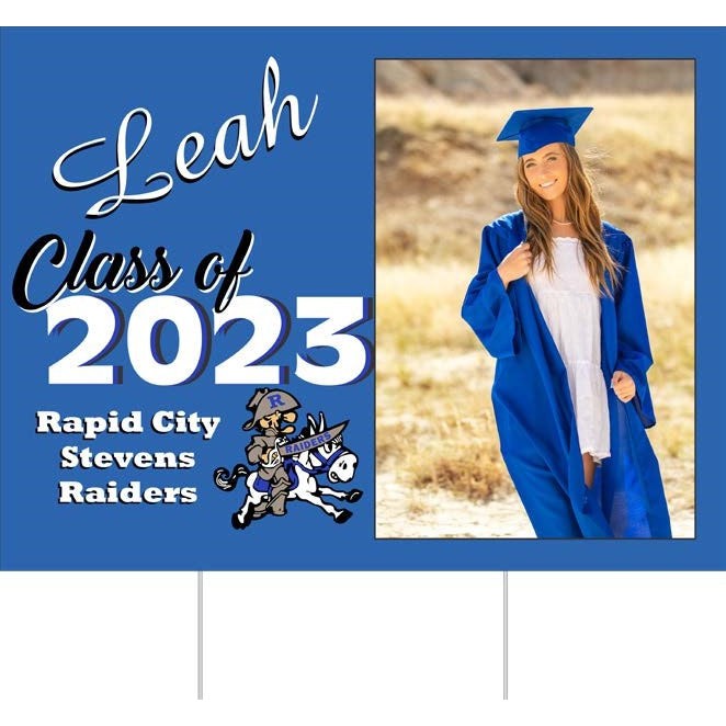 Blue 18"x24" yard sign with "Leah Class of 2023 Rapid City Stevens Raiders" text, school mascot, and graduate photo.
