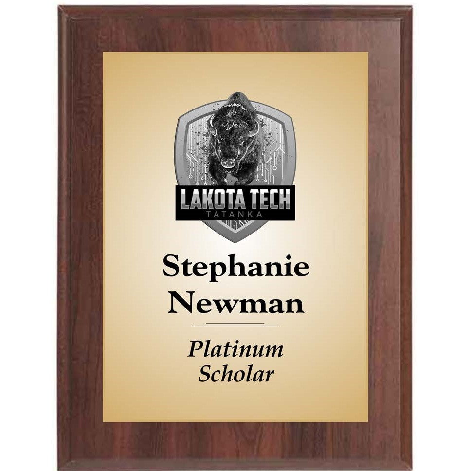 Ebony finished plaque with gold-tone engraving plate, "Lakota Tech" logo, and "Stephanie Newman Platinum Scholar" text.