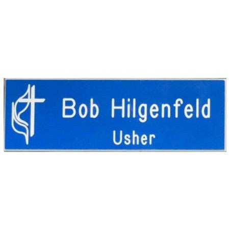 Blue 1" x 3" engraved name badge with white text "Bob Hilgenfeld Usher" and a white cross logo.