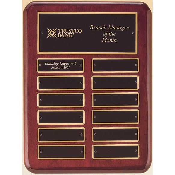 Glossy 9"x12" rosewood perpetual plaque with 12 brass plates, "Trustco Bank Branch Manager of the Month" engraved.