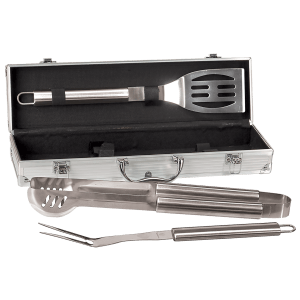 Silver aluminum case with black lining, holding a stainless steel spatula, tongs, and fork.