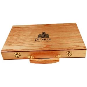 Light brown wooden backgammon case with gold latches, handle, and "DUNBAR" logo.
