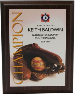 Dark wood Babe Ruth Baseball Champion plaque with glove, ball, and "Keith Baldwin" text.