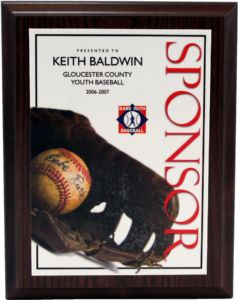 Dark wood plaque with "SPONSOR" in red, featuring a baseball glove, ball, and Babe Ruth Baseball logo.