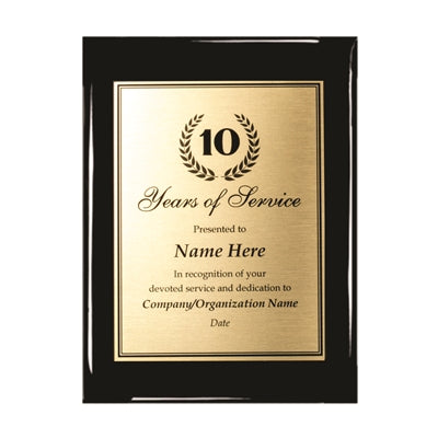 Glossy black ebony piano plaque with a gold aluminum plate engraved "10 Years of Service.