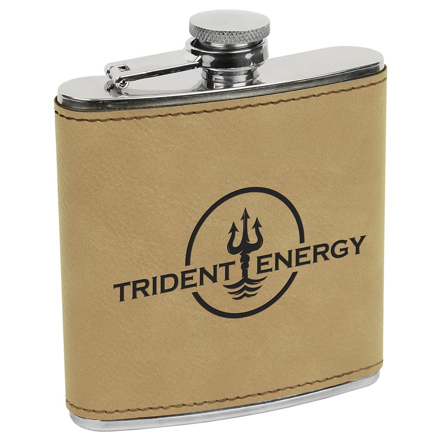 6 oz. laserable tan leatherette stainless steel flask with "Trident Energy" logo.