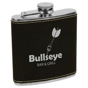 6 oz. black laserable leatherette stainless steel flask with a silver dart and "Bullseye BAR & GRILL" logo.
