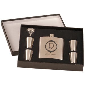 Personalized stainless steel flask set with funnel and four shot glasses in a black presentation box.