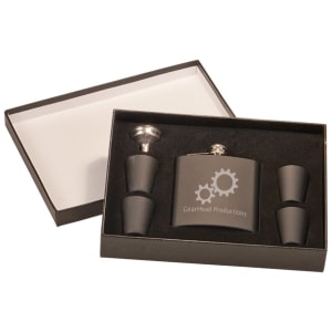 Black 6 oz. leatherette flask with custom laser engraving, four shot glasses, and funnel in a black presentation box.