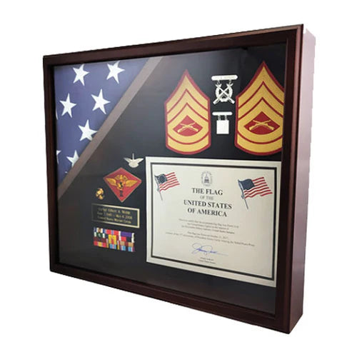Cherry wood flag shadow box case with glass front, displaying a folded flag, medals, and military awards.