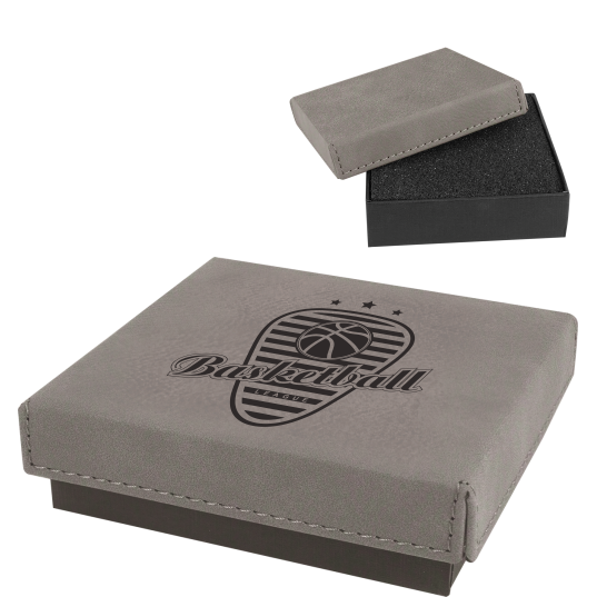 Gray personalized faux leather medallion display box with laser-engraved basketball logo and black foam insert.