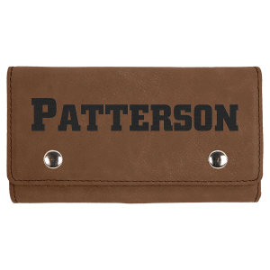 Brown laserable leatherette card and dice set case with "PATTERSON" engraved and silver snaps.