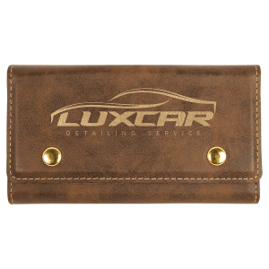 Brown laserable leatherette card & dice set case with gold snaps and "LUXCAR" logo.