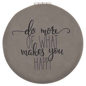 Round gray laserable leatherette compact mirror with "do more of what makes you happy" engraving.