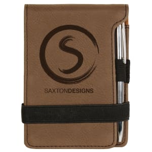 Brown laserable leatherette mini notepad (3 1/4" x 4 3/4") with pen, elastic band, and custom "S" logo.