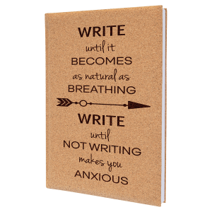 Tan leatherette journal with "WRITE until it BECOMES as natural as BREATHING" quote and arrow design.