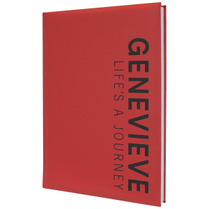 Red 7" x 9 3/4" laserable leatherette journal with "GENEVIEVE LIFE'S A JOURNEY" text.