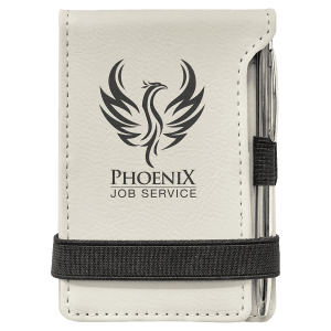 Cream laserable leatherette mini notepad with a black phoenix logo, pen, and elastic band.
