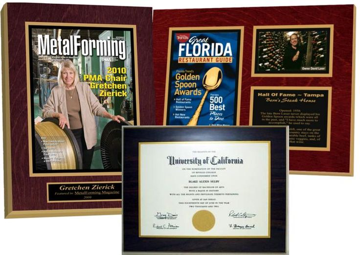 Three custom laminated plaques: one with a magazine cover, one with a diploma, and one with a restaurant guide and photos.
