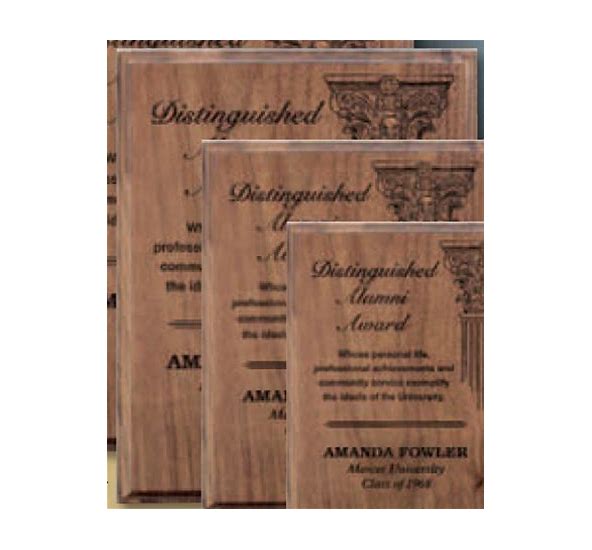 Wooden award plaque with engraved text on a white background
