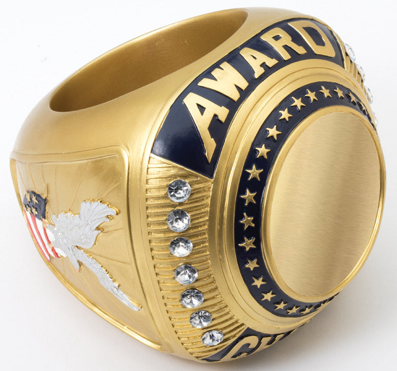 Gold Mega Ring award with "AWARD" text, stars, clear gems, and an eagle design.