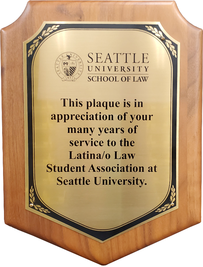 Solid walnut plaque with notched corners and a gold plate engraved for Seattle University School of Law.