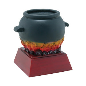 Black chili pot award with red and orange flames on a dark wood base.