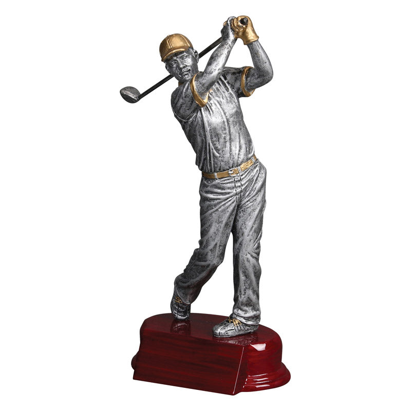 Silver resin male golfer statue with gold accents, mid-swing, on a cherry-finished base.