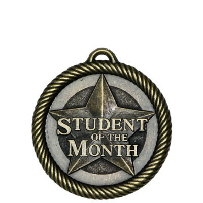 Antique gold and silver Scholastic "Student of the Month" medal with a star design and rope border.