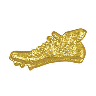 Shiny gold varsity chenille pin shaped like a track shoe with cleats.
