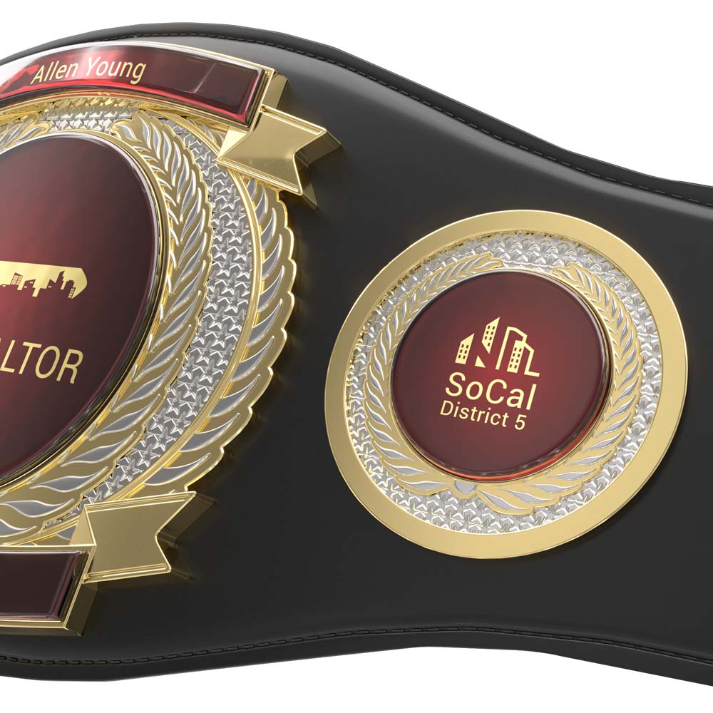 Black leather championship belt with gold and red medallions, custom name plates, and intricate detailing.
