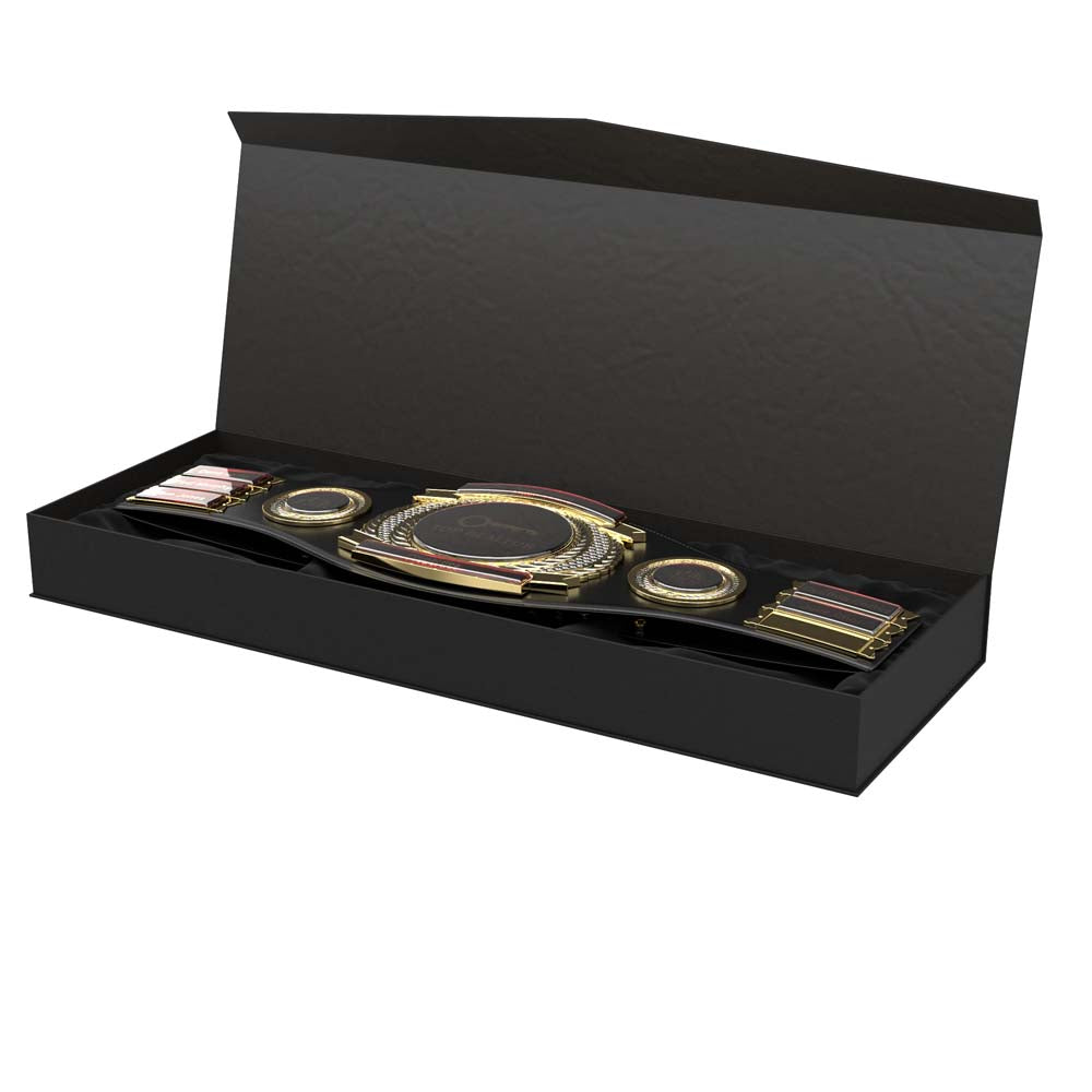Black leather championship belt with gold and red plates, displayed in a velvet-lined presentation box.