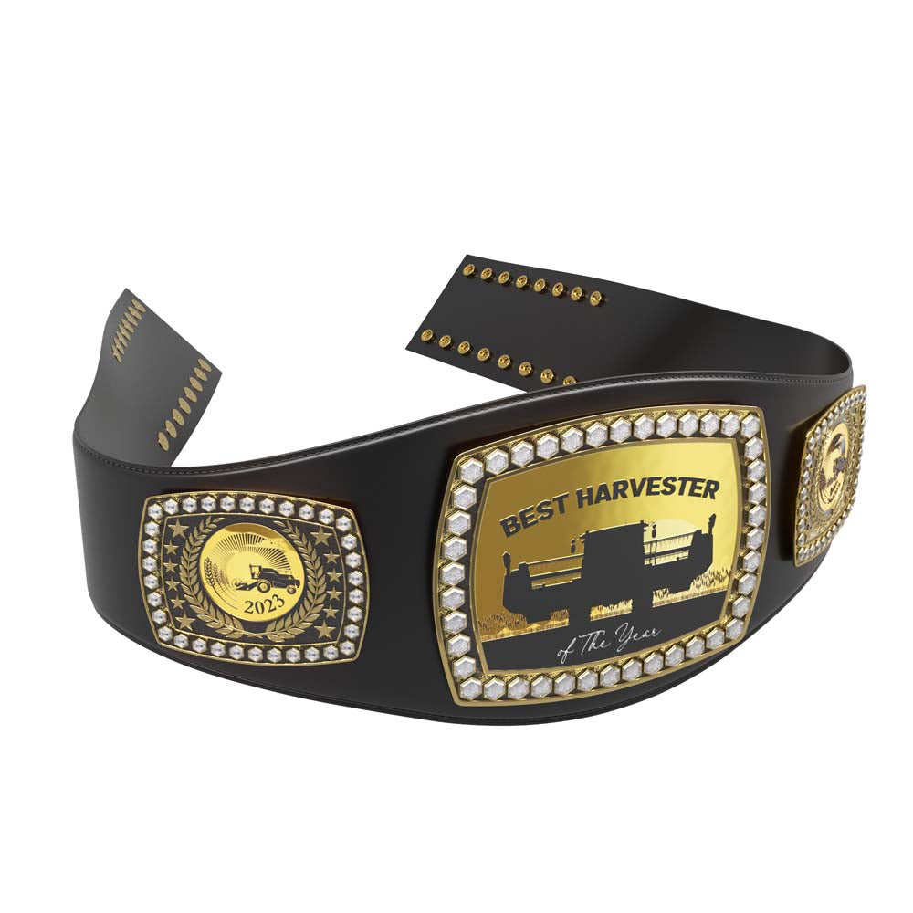 Black leather championship award belt with gold plates, diamond-like stones, and "Best Harvester of the Year" text.