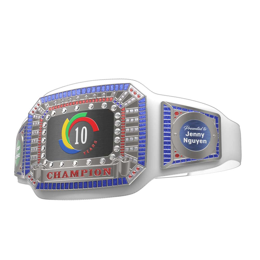 White leather championship belt with a "10 Years" logo, "CHAMPION" text, and blue, red, and clear synthetic gemstones.