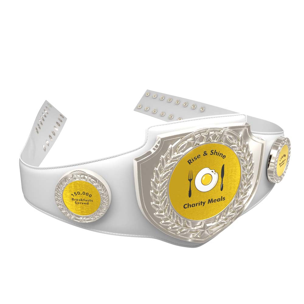 White vegan leather Adult Championship Award Belt with gold and silver "Rise & Shine" charity meals design.