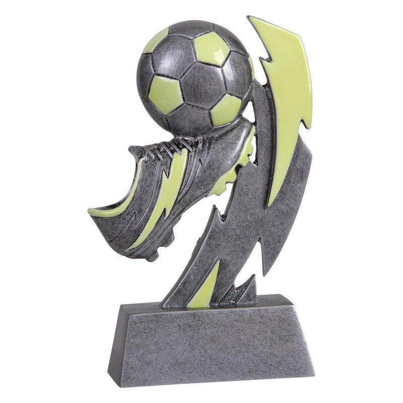 Glow-in-the-dark sport resin trophy featuring a 3D soccer ball, cleat, and lightning bolt design on a gray base.