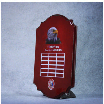 Scalloped piano-finished plaque in mahogany with an Eagle Scout logo and grid for perpetual awards.
