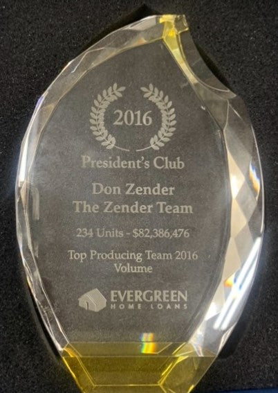 Clear crystal award with faceted edges, gold base, and engraved text for "President's Club Don Zender The Zender Team".